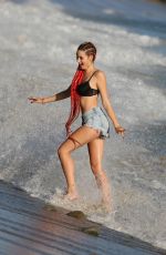 ASHLEY BRINTON in Shorts and Bikini Top at a Beach in Malibu 10/18/2018