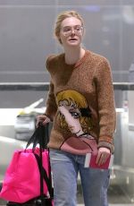 OLIVIA WILDE and ELLE FANNING at JFK Airport in New York 10/01/2018