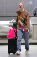 OLIVIA WILDE and ELLE FANNING at JFK Airport in New York 10/01/2018