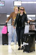 OLIVIA WILDE and ELLE FANNING at JFK Airport in New York 10/01/2018