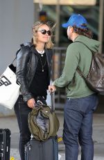 OLIVIA WILDE and Jason Sudeikis at JFK Airport in New York 10/01/2018
