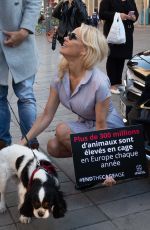 PAMELA ANDERSON Protests Breeding of Animals in Cages in Paris 10/10/2018