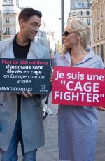 PAMELA ANDERSON Protests Breeding of Animals in Cages in Paris 10/10/2018