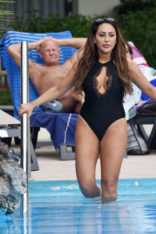 SOPHIE KASAEI in Swimsuit at a Pool in Tenerife 09/30/2018