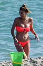 ALANA and MARIELLE HADID in Bikinis at a Beach in Miami 11/21/2018