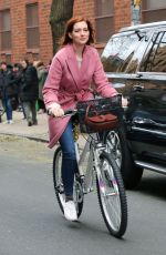 ANNE HATHAWAY Riding a Bike on the Set of Modern Love in New York 11/28/2018