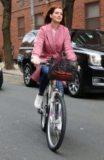 ANNE HATHAWAY Riding a Bike on the Set of Modern Love in New York 11/28/2018