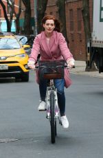 ANNE HATHAWAY Riding a Bike on the Set of Modern Love in New York 11/28/2018