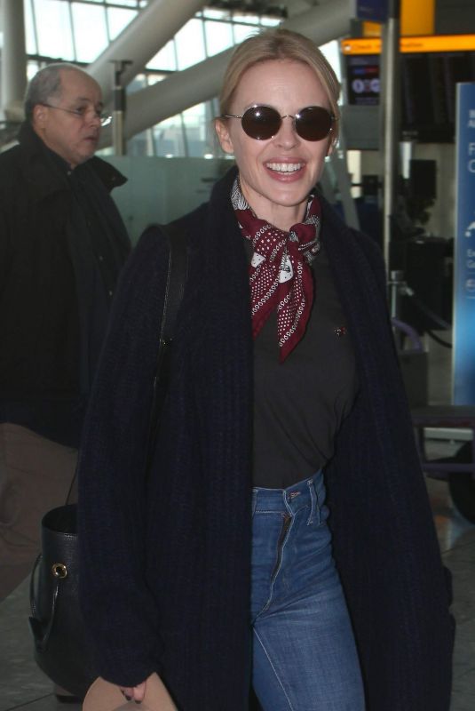 KYLIE MINOGUE at Heathrow Airport in London 11/08/2018