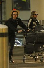 ASHLEY BENSON and CARA DELEVINGNE at Gatwick Airport in London 12/21/2018