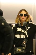 ASHLEY BENSON and CARA DELEVINGNE at Gatwick Airport in London 12/21/2018