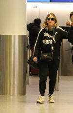 ASHLEY BENSON and CARA DELEVINGNE at Gatwick Airport in London 12/21/2018