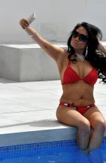 CHRISIE WUNNA in Bbikini at a Pool in Spain 12/30/2018