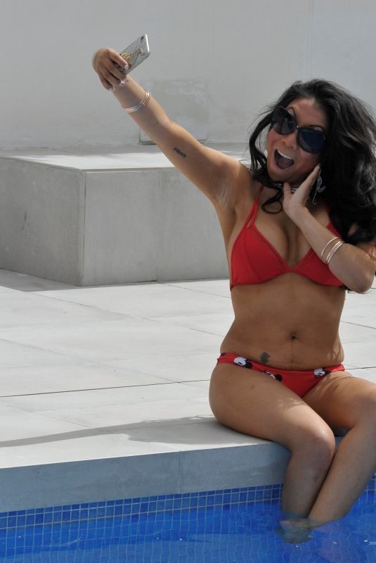 CHRISIE WUNNA in Bbikini at a Pool in Spain 12/30/2018