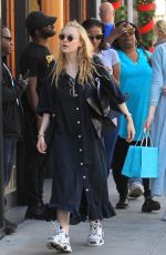 DAKOTA and ELLE FANNING Shopping on Rodeo Drive in Beverly Hills 12/26/2018