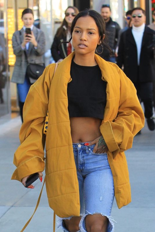 KARRUECHE TRAN in Ripped Jeans Out Shopping in Beverly Hills 12/28/2018