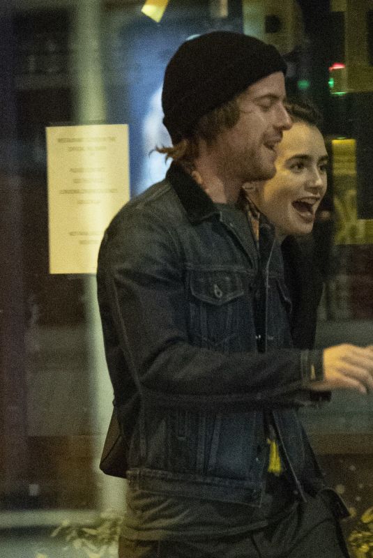 LILY COLLINS and Harry Treadaway Night Out in London 12/04/2018