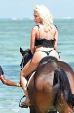 MEGAN BARTON HANSON in Bikini Riding a Horse at a Beach in Mauritius 12/23/2018