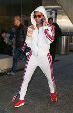 MELANIE BROWN at LAX Airpost After Fracturing Two Ribs 12/21/2018