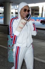 MELANIE BROWN at LAX Airpost After Fracturing Two Ribs 12/21/2018