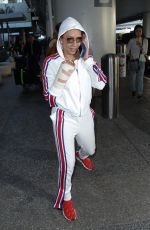MELANIE BROWN at LAX Airpost After Fracturing Two Ribs 12/21/2018