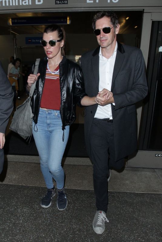 MILLA JOVOVICH and Paul W. S. Anderson Night Out in Los Angeles 12/21/2018