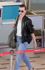 MILLA JOVOVICH and Paul W.S. Anderson at Cape Town International Airport 12/15/2018