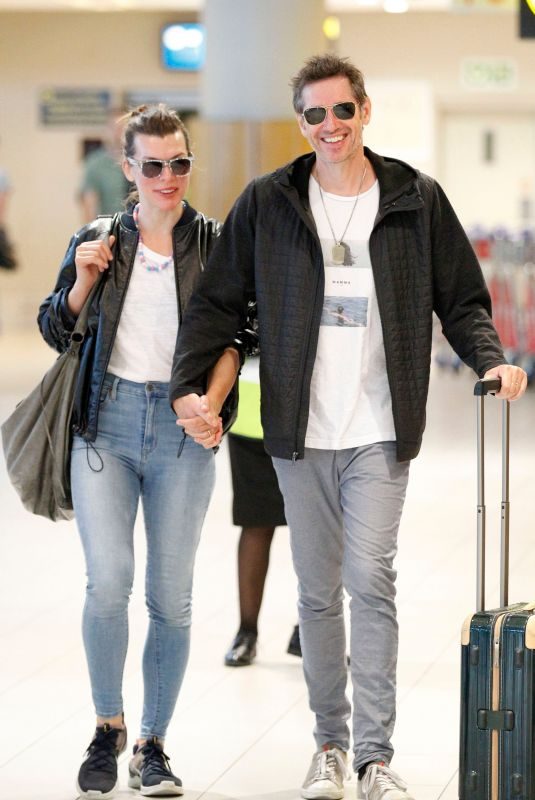 MILLA JOVOVICH and Paul W.S. Anderson at Cape Town International Airport 12/15/2018