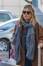 SIENNA MILLER at Heathrow Airport in London 12/27/2018