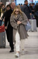 DAKOTA FANNING Arrive at CDG Airport in Paris 01/21/2019