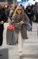 DAKOTA FANNING Arrive at CDG Airport in Paris 01/21/2019