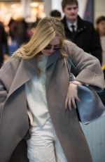DAKOTA FANNING Arrive at CDG Airport in Paris 01/21/2019