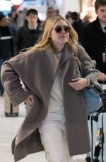 DAKOTA FANNING Arrive at CDG Airport in Paris 01/21/2019