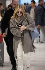 DAKOTA FANNING Arrive at CDG Airport in Paris 01/21/2019