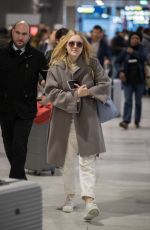 DAKOTA FANNING Arrive at CDG Airport in Paris 01/21/2019