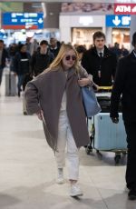DAKOTA FANNING Arrive at CDG Airport in Paris 01/21/2019