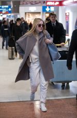 DAKOTA FANNING Arrive at CDG Airport in Paris 01/21/2019