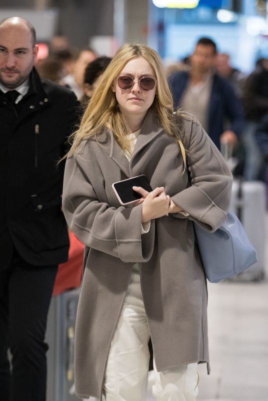 DAKOTA FANNING Arrive at CDG Airport in Paris 01/21/2019