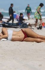 KIMBERLEY GARNER in Bikini Workout at a Beach in Miami 01/28/2019