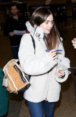 LILY COLLINS at Salt Lake City Airport 01/25/2019
