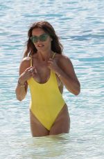 LIZZIE CUNDY in a Yellow Swimsuit on the Beach in Barbados 01/03/2019