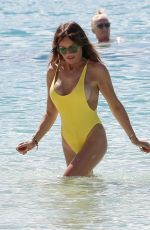 LIZZIE CUNDY in a Yellow Swimsuit on the Beach in Barbados 01/03/2019