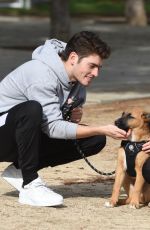 MICHELLE RANDOLPH mad Gregg Sulkin with Their Dog at a Park in Los Angeles 01/12/2019