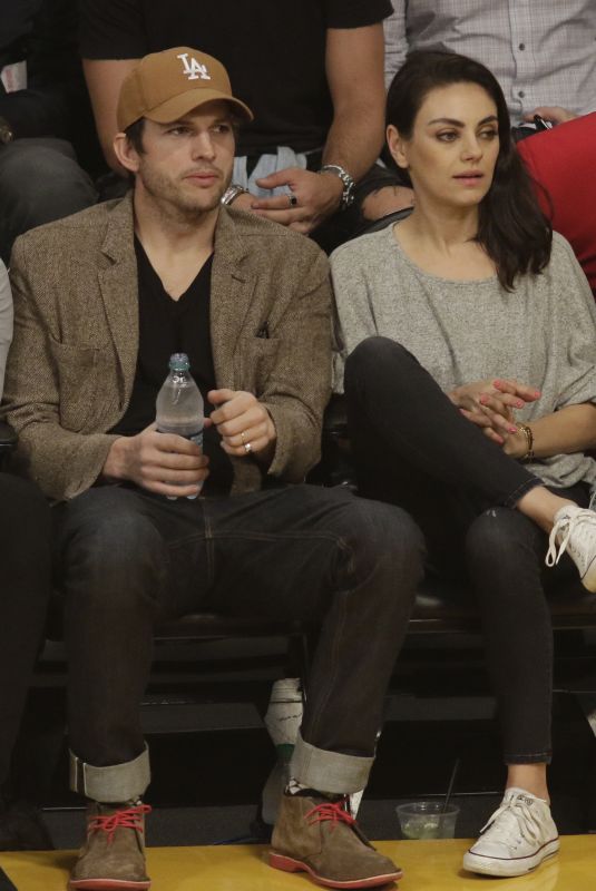 MILA KUNIS and Ashton Kutcher at LA Lakers vs Philadelphia 76