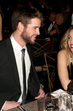 MILEY CYRUS and Liam Hemsworth at G