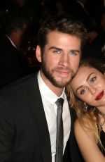 MILEY CYRUS and Liam Hemsworth at G