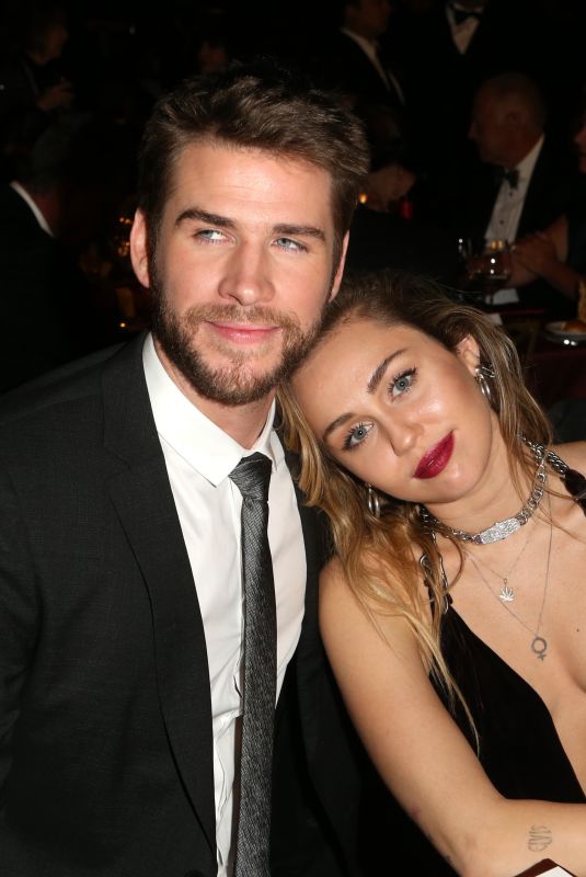 MILEY CYRUS and Liam Hemsworth at G