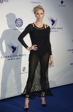 CHARLIZE THERON at Cinema for Peace International Committee and Nominee Dinner 02/10/2019