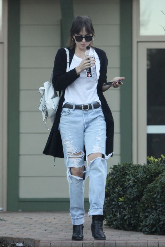 DAKOTA JOHNSON in Ripped Jeans Out in Los Angeles 02/11/2019