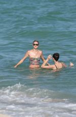 DEVON WINDSOR and GABBY WESTBROOK-PATRICK in Bikinis at a Beach in Miami 02/17/2019